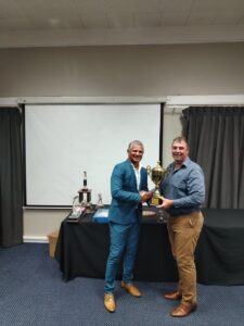 Defence (WP) Golf Awards Event 2024 - A. Kriger receiving a trophy from the Vice Chairperson