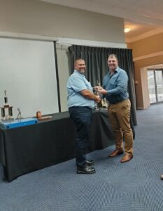 Defence WP Golf Awards function 2024 C. Coetzee receiving a trophy