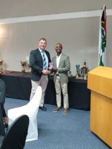 Defence (WP) Golf Club Awards Event 2025 — K. Papier accepting the Rookie trophy as part of the evening’s honours.