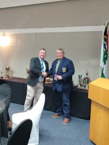 Defence (WP) Golf Club Awards Event 2025, showing V. Seini receiving a prize voucher during the awards ceremony.