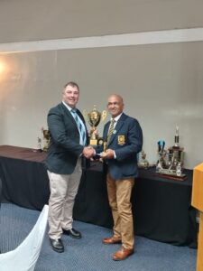Defence (WP) Golf Club Awards Event 2025, showing N. Solomons receiving a trophy during the awards ceremony.