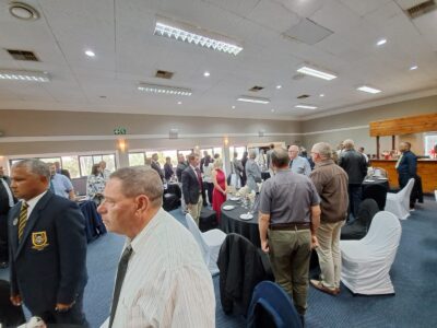 Members standing during the Defence (WP) Golf Club Awards Event 2025 while the code of conduct is being read.