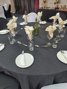 Close-up of a decorated table setup at the Defence (WP) Golf Club Awards Event 2025, showing event décor and table arrangements.