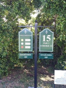 Course signage at Royal Cape Golf Club showing distance markers for different tee boxes on the 15th hole, along with the club’s established date of 1885.