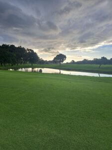 Scenic view of the course with water and dramatic sky at Rondebosch Golf Club