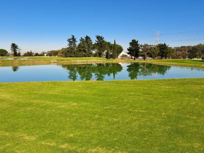 Water hazard with tree reflections at Kuilsriver Golf Club, LIV 4, April 2026.