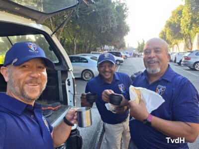 Three golfers enjoying pre-round snacks at the car park at Rondebosch Golf Club, January 2026.