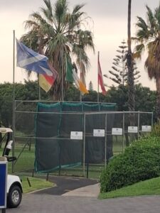 Flags and club insignia at the practice area of Rondebosch Golf Club, MP 1, March 2026.