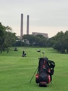 Golf bag on the Par 5 fairway at Rondebosch Golf Club with the old power station twin chimneys in the background, MP 1, March 2026.