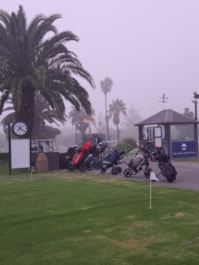 Golf bags and trolleys at Rondebosch Golf Club in early morning mist, MP 1, March 2026.